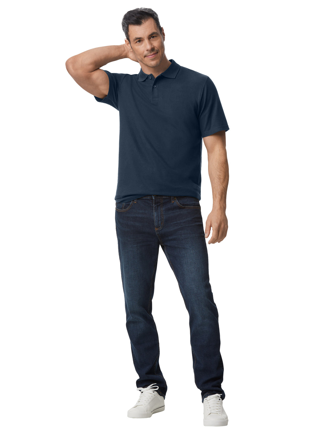 Model wearing a navy Gildan Softstyle Adult Pique Polo paired with jeans, demonstrating its versatile and stylish fit for casual wear.