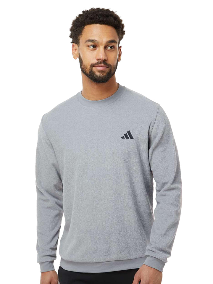 Gray Adidas crewneck sweatshirt with a minimalist embroidered logo. Soft, lightweight, and perfect for layering in any season.