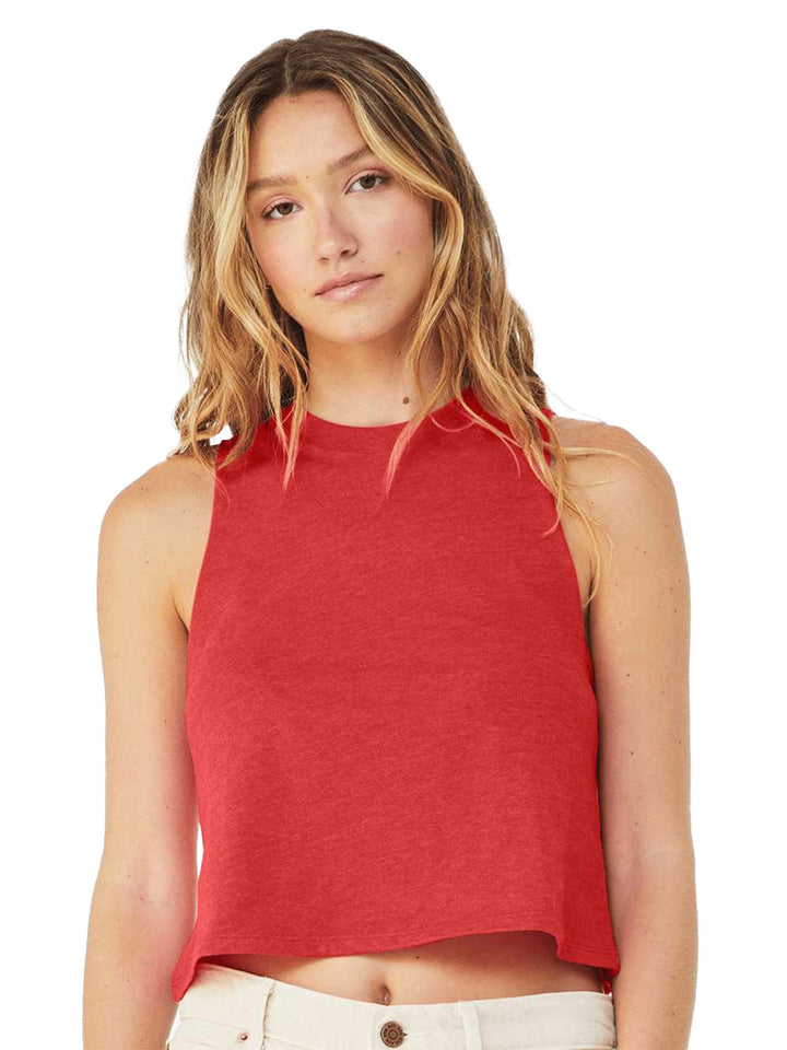 Bella + Canvas Women’s Racerback Crop Tank in red, showcasing a relaxed fit and sleeveless cut. Styled with light-colored denim.