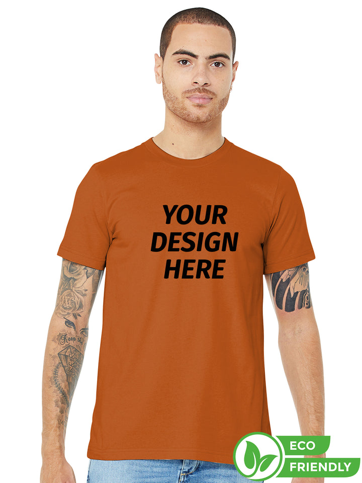 BELLA + CANVAS Jersey Tee 3001 in burnt orange with 'Your Design Here' text, ideal for custom printing. Eco-friendly unisex t-shirt for personalized apparel.