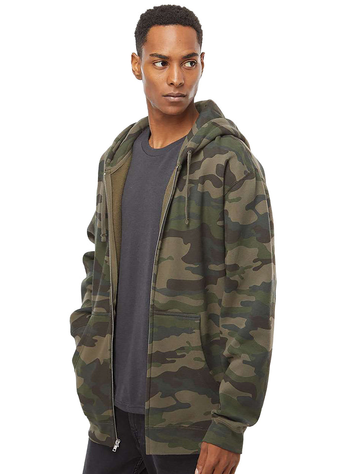 Side view of the Custom Independent Trading Co Heavyweight Full Zip Hoodie in camouflage, showcasing its relaxed fit and durable fabric.