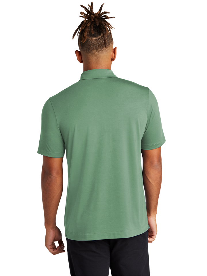 Back view of the Mercer+Mettle Stretch Jersey Polo in green, showcasing its smooth fabric and tailored fit. Perfect for customization and casual wear.