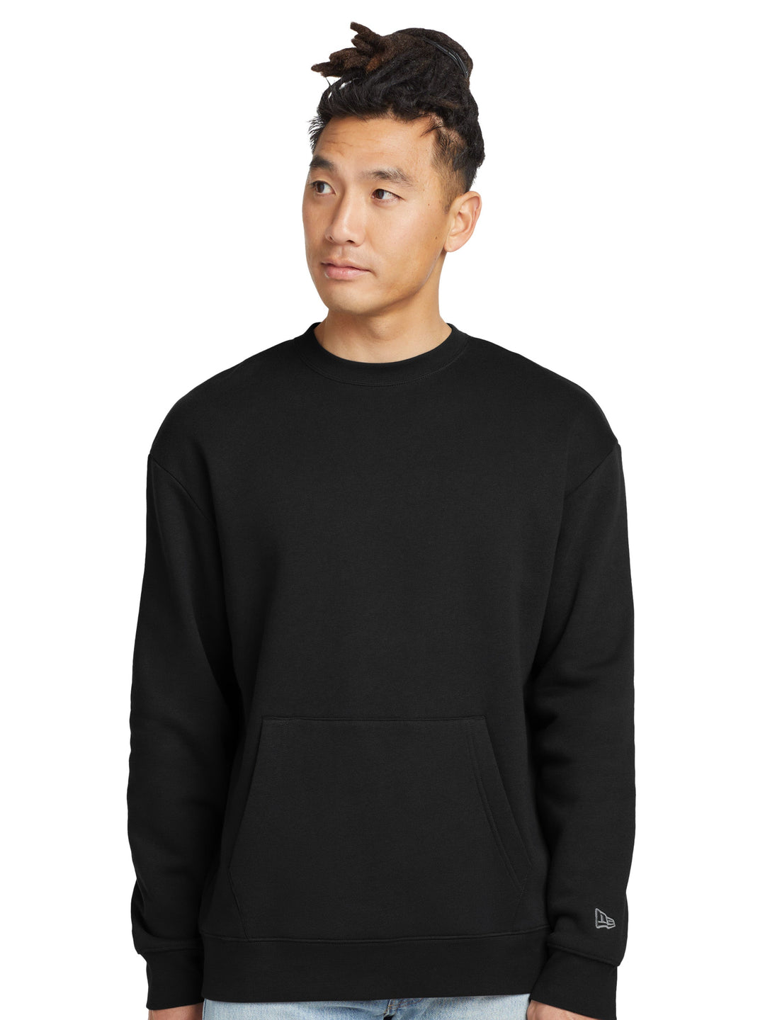 New Era Heritage Fleece Pocket Crewneck in black, featuring a cozy fleece design with a rare front pocket. Perfect for custom embroidery or printing.