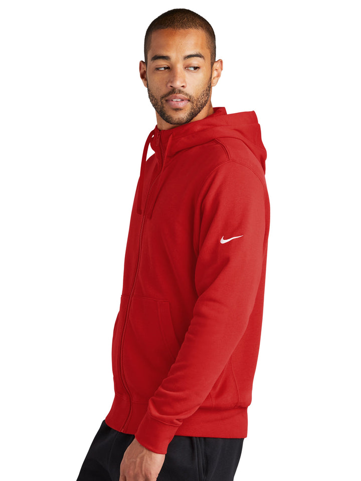 Side view of the red Nike Fleece Full Zip Hoodie, showcasing its comfortable fit, adjustable hood, and signature Nike swoosh on the sleeve.