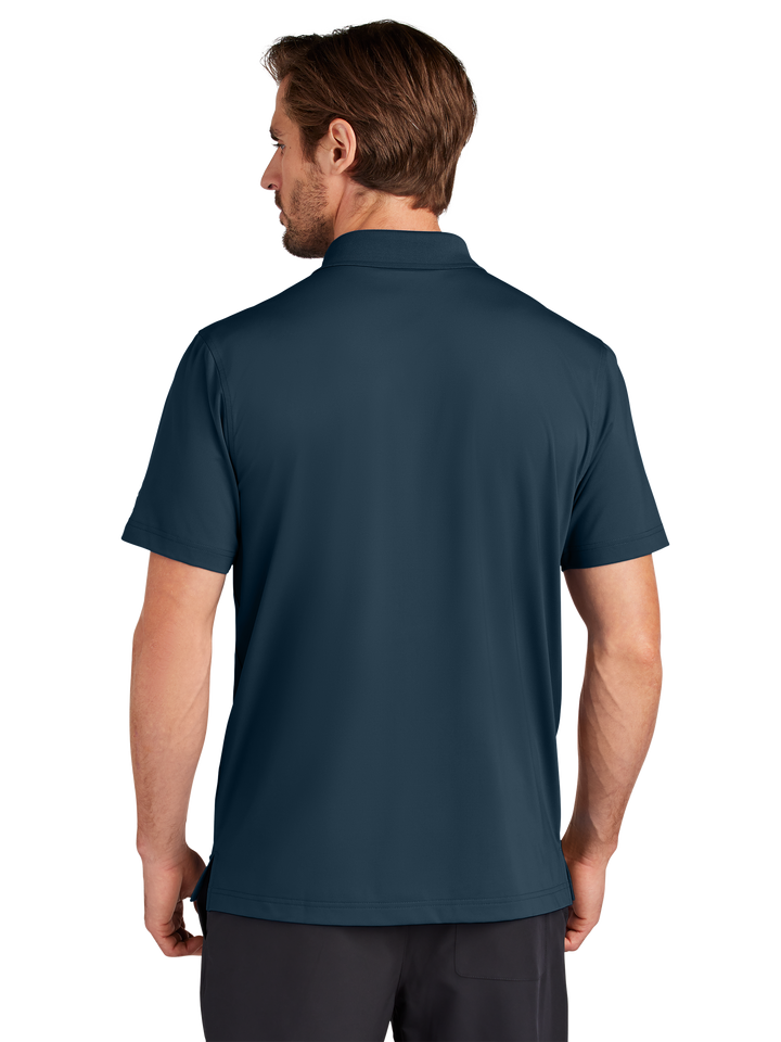 Back view of the Custom OGIO Regain Polo in navy blue, showcasing its breathable fabric and sleek design. Perfect for corporate or casual styling.