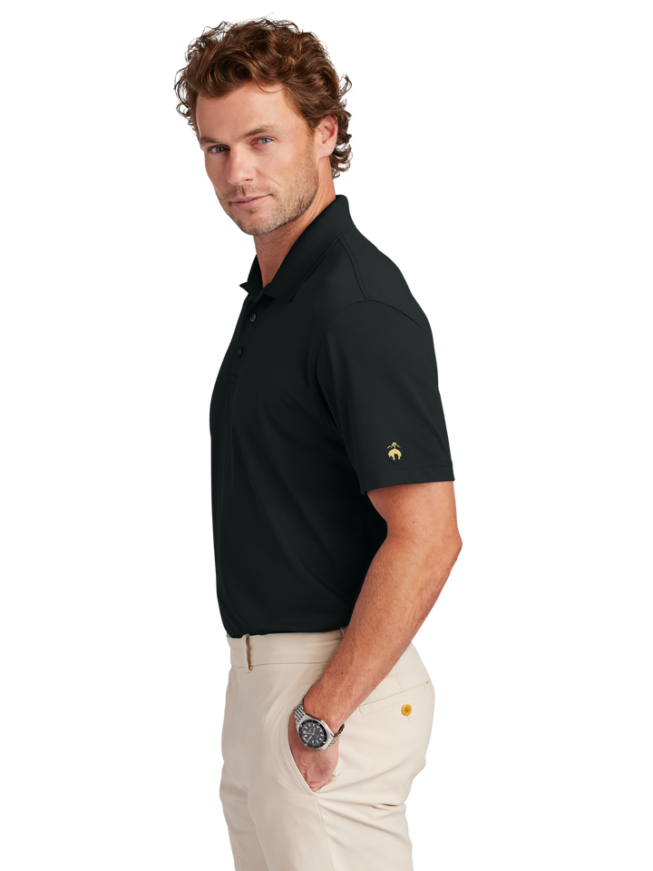 Side view of Brooks Brothers BB18220 Polo in black, showcasing its tailored fit and embroidered sleeve logo. Ideal for business or casual wear.