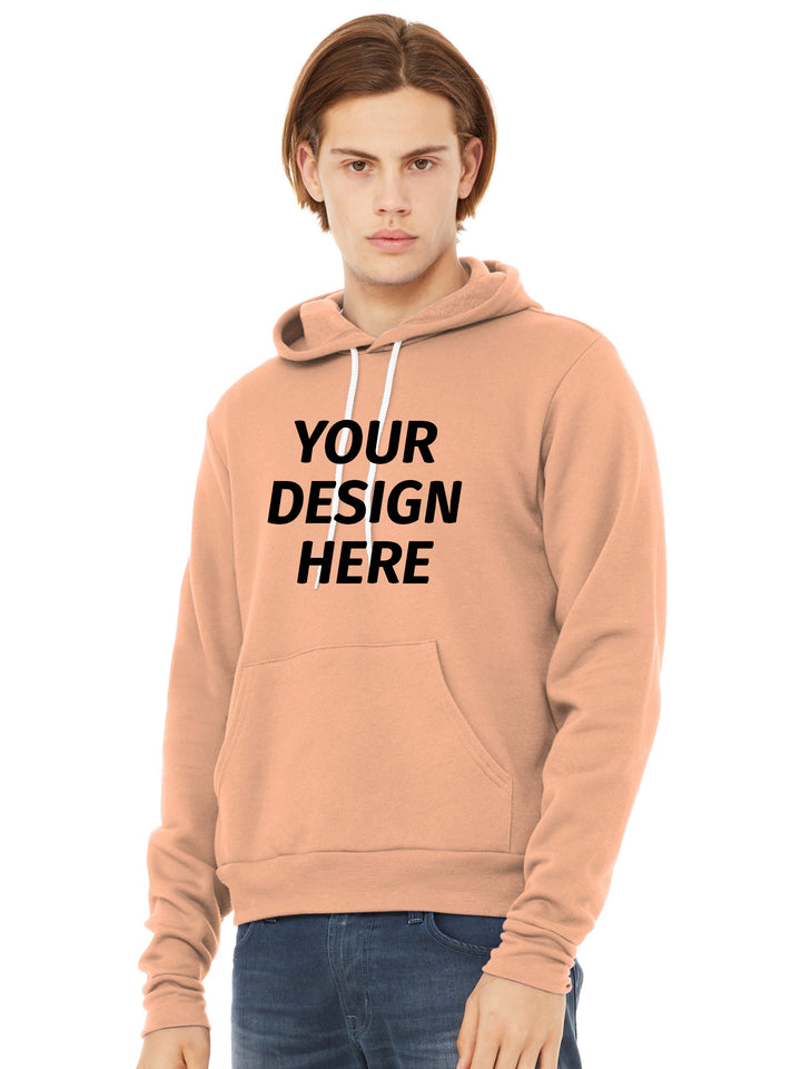 Custom Bella + Canvas Sponge Fleece Hoodie in peach with 'Your Design Here' text. Ideal for personalized printing or embroidery for apparel branding.