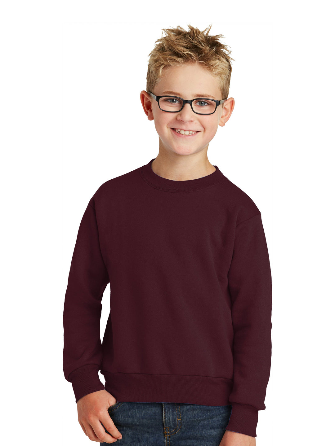 Port and Company Youth Core Fleece Crewneck Sweatshirt in maroon, worn by a smiling child. Soft, cozy, and perfect for customization.