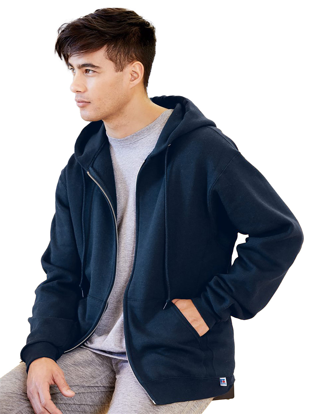 Russell Athletic Dri Power Full Zip Hoodie in black, featuring a moisture-wicking cotton-poly blend, front pouch pocket, and ribbed knit cuffs for comfort.