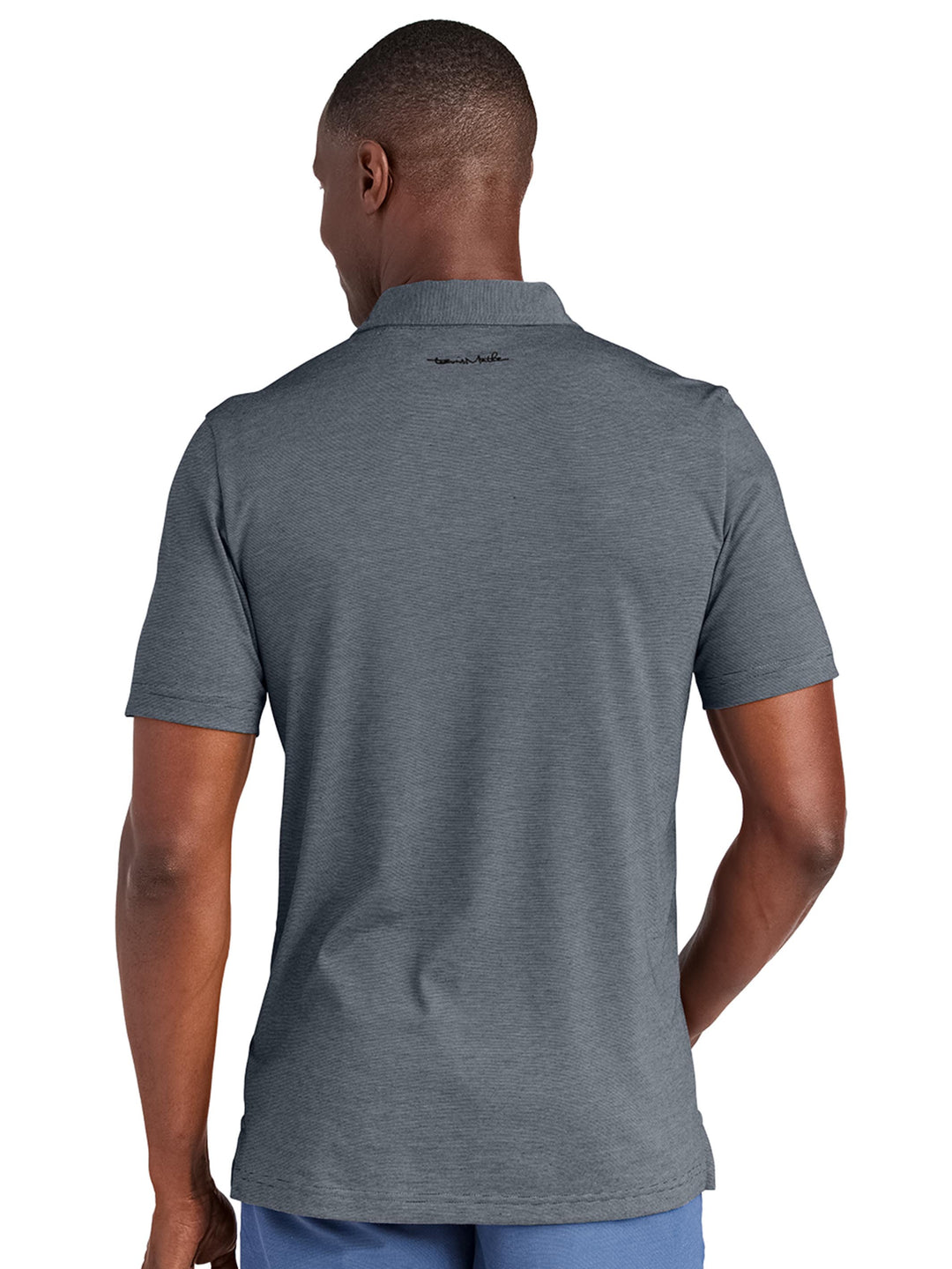 Back view of the TravisMathew Sunnyvale Polo in dark gray, showcasing the subtle logo detail below the collar. Ideal for custom branding with no minimums.