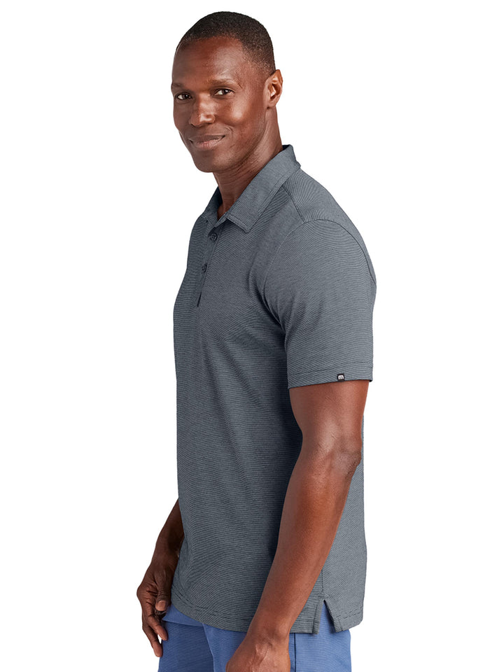 Side view of the TravisMathew Sunnyvale Polo in dark gray, highlighting the premium fabric and tailored fit. Perfect for corporate or casual wear.
