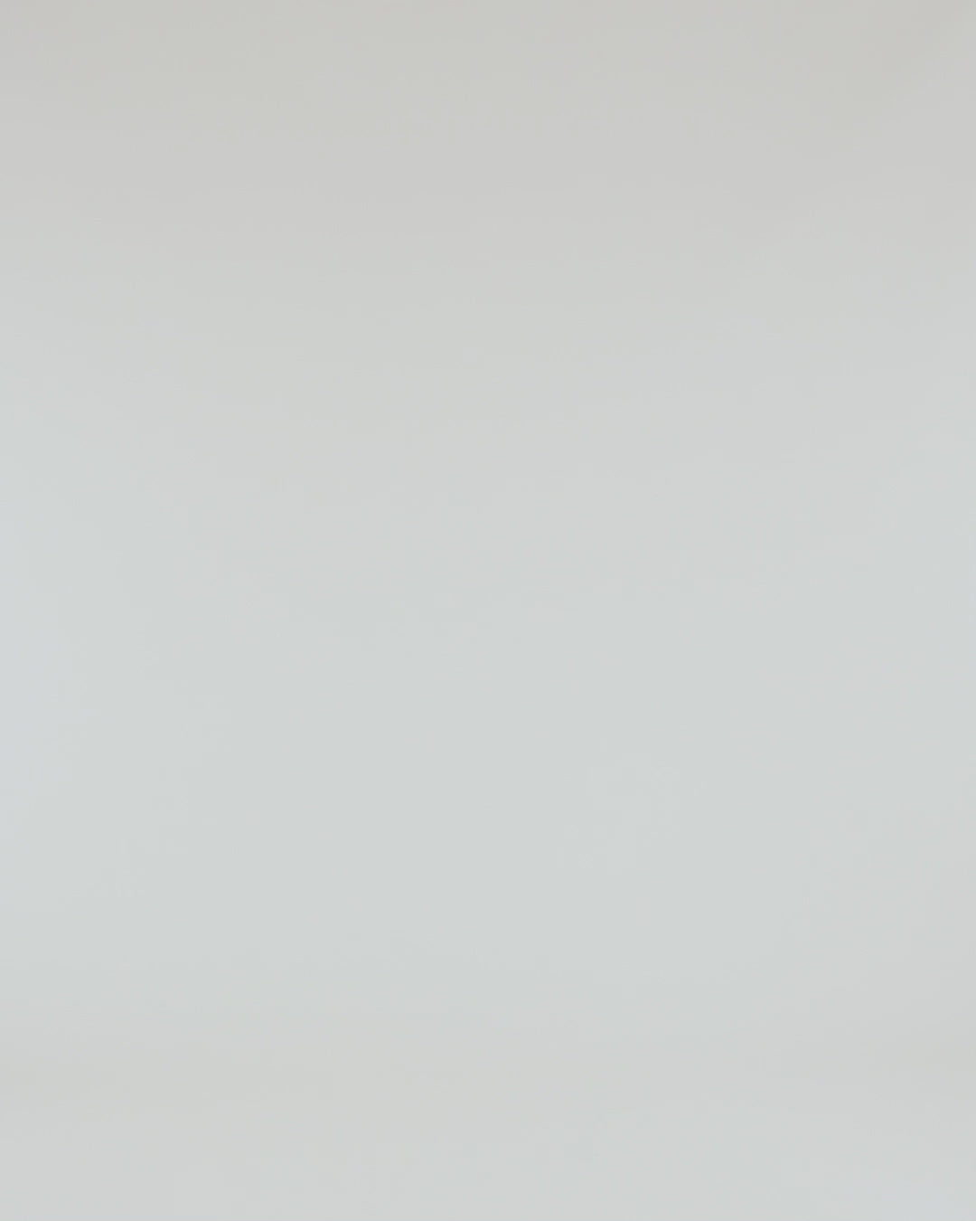 Close-up of the fabric texture of the Independent Trading Co Premium Heavy Weight Cross-Grain Hoodie in white.