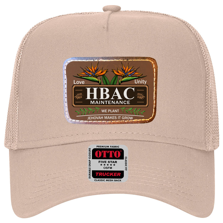 HBAC Otto 5 Panel Low Profile Trucker hat in beige with a metallic patch displaying 'HBAC Maintenance' logo, bird of paradise flowers, and faith-inspired message.