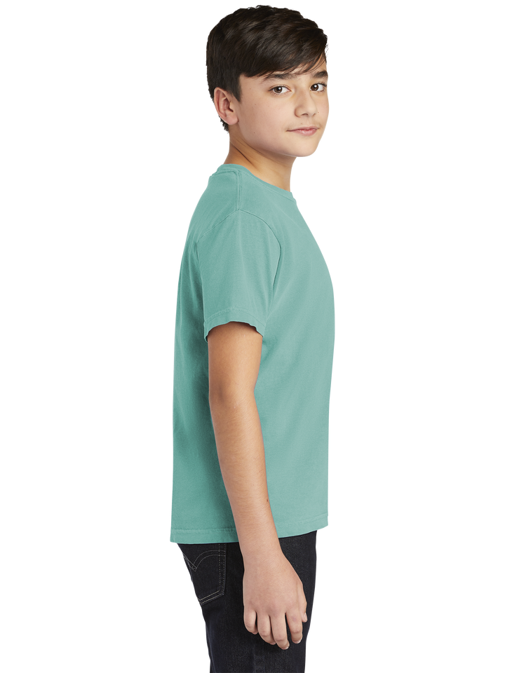 Side view of the Comfort Colors Youth Heavyweight Ring Spun Tee- 9018 in teal, highlighting its sturdy construction and relaxed silhouette.
