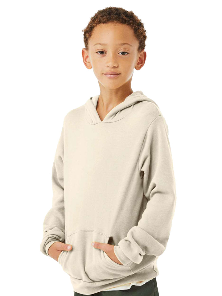 Youth wearing a Custom Bella + Canvas Sponge Fleece Hoodie in off-white with a relaxed fit and front pocket. Ideal for personalized designs and everyday comfort.
