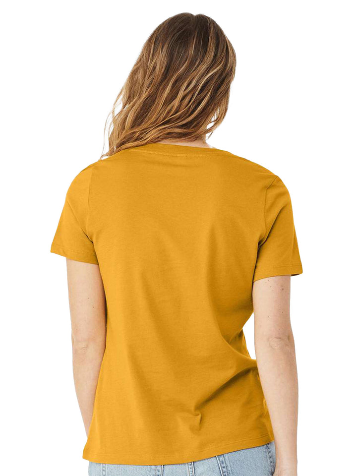 Back view of mustard yellow Bella + Canvas woman's v-neck tee, showcasing its soft fabric and relaxed fit. A stylish everyday essential.