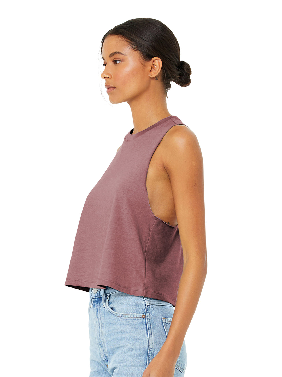 Side view of Bella + Canvas Women’s Racerback Crop Tank in mauve, showcasing its loose fit and deep armholes. Perfect for casual wear.