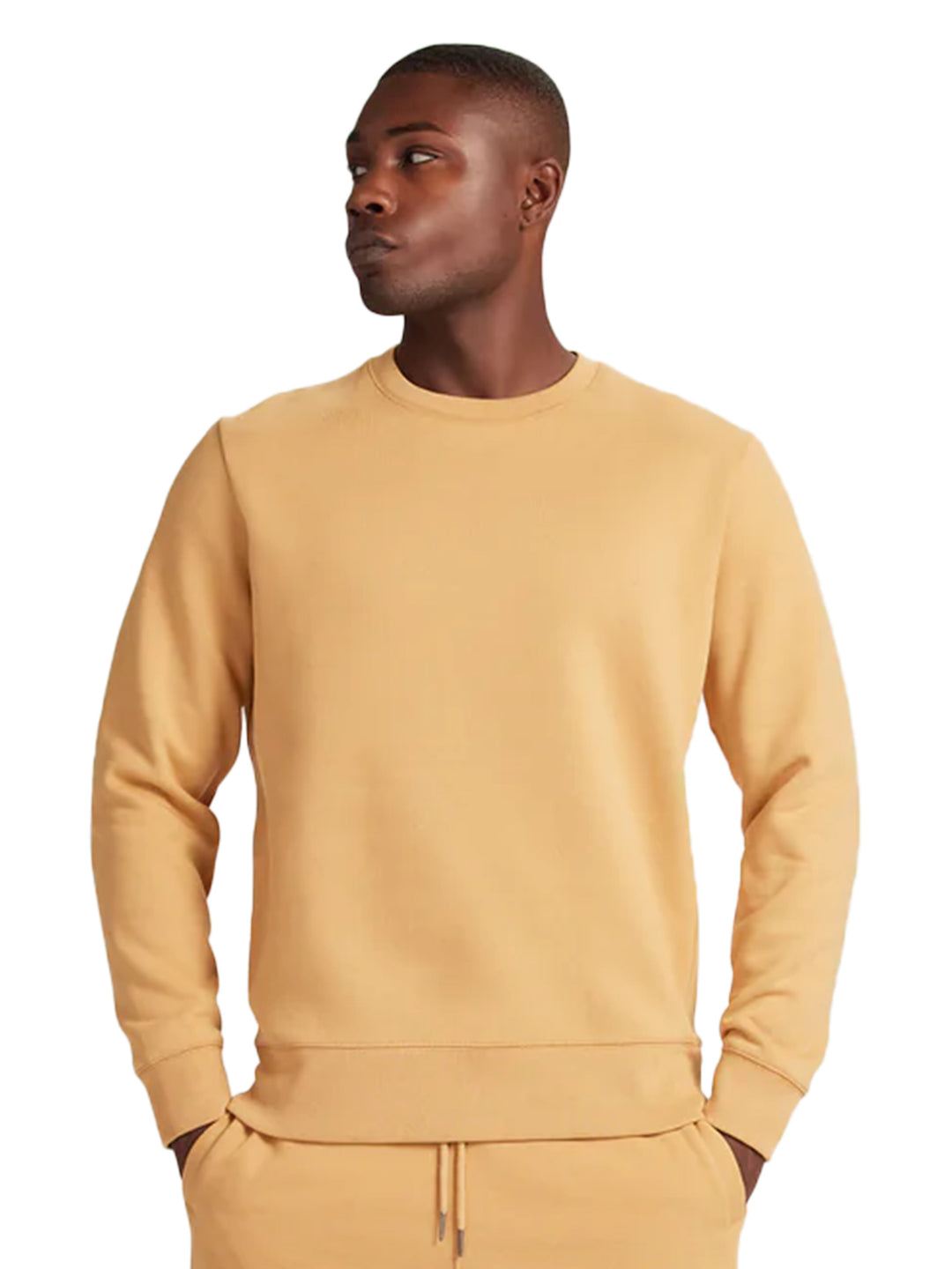 Side view of a tan Original Favorites crewneck sweatshirt. High-quality heavyweight material for a stylish and comfortable fit.