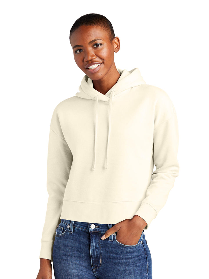 Cream-colored District Women's V.I.T. Fleece Cropped Hoodie, offering a soft and stylish option for casual outfits.