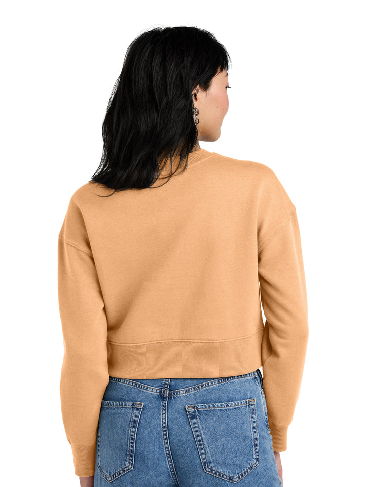 Back view of District Women's Perfect Weight Fleece Cropped Crewneck in camel color, highlighting the relaxed fit and ribbed hem design.