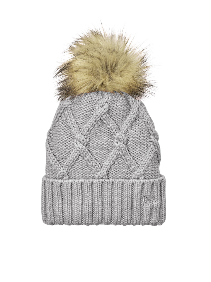 New Era® Faux Fur Pom Beanie NE911 in light gray with a trendy cable knit design and faux fur pom. Available for custom embroidery to showcase your brand.