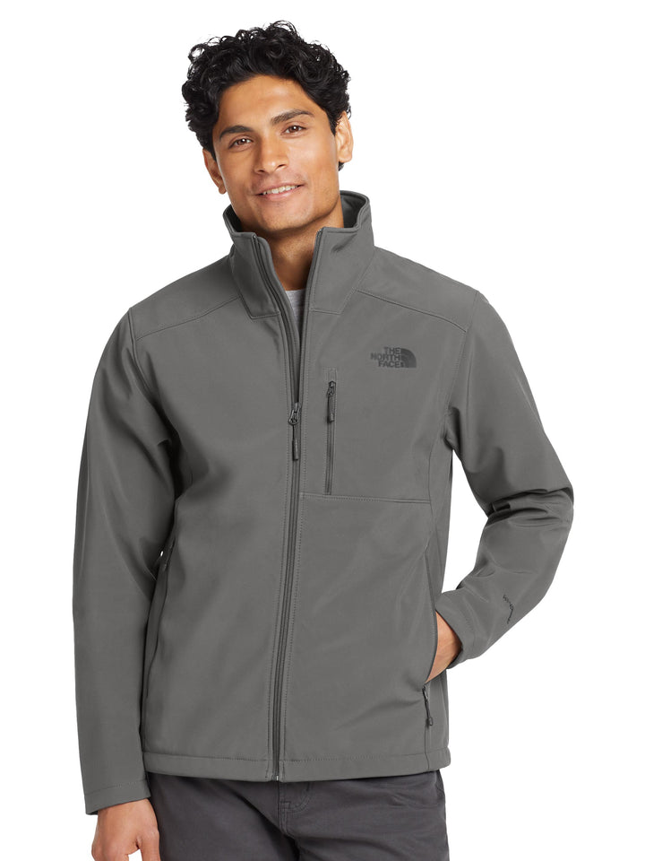 The North Face® Apex Barrier Soft Shell Jacket in charcoal gray, designed for durability and comfort in outdoor conditions.