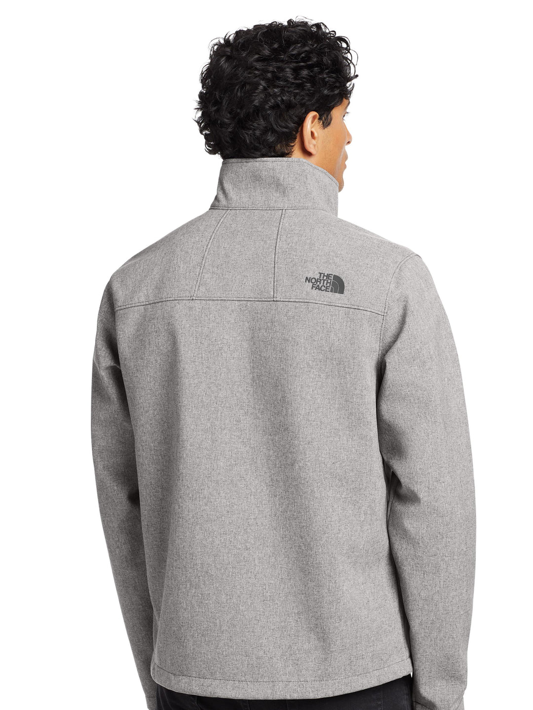 Back view of The North Face® Apex Barrier Soft Shell Jacket in heather gray, showcasing high collar and rear logo placement.