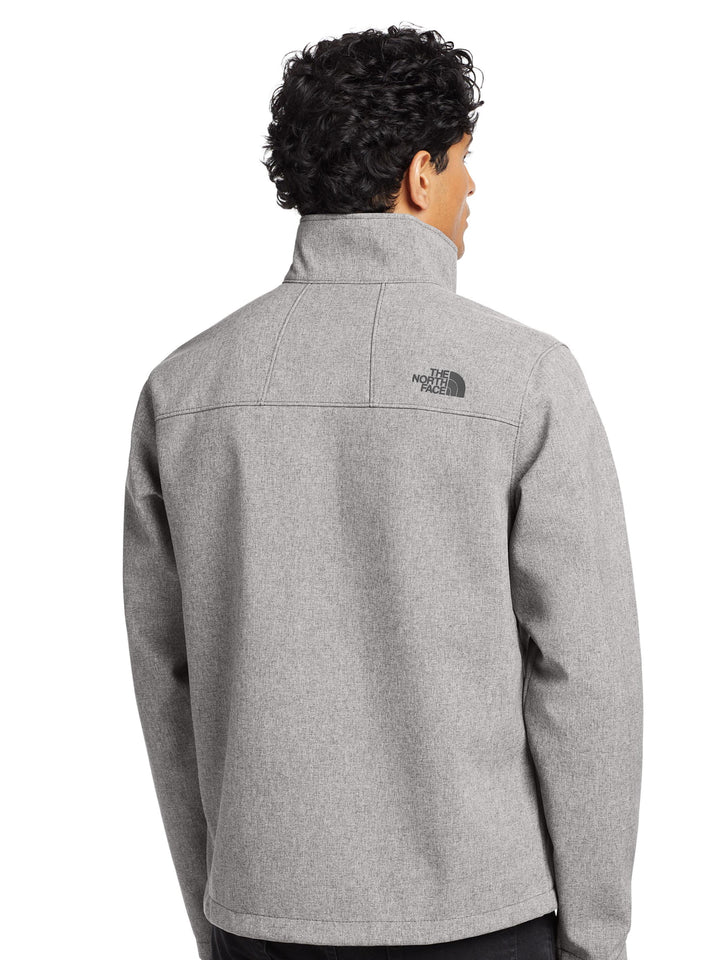 Back view of The North Face® Apex Barrier Soft Shell Jacket in heather gray, showcasing high collar and rear logo placement.