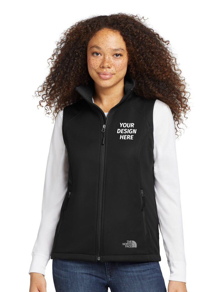 The North Face® Women's Ridgewall Soft Shell Vest in black with 'Your Design Here' text, ideal for custom embroidery and personalized workwear.
