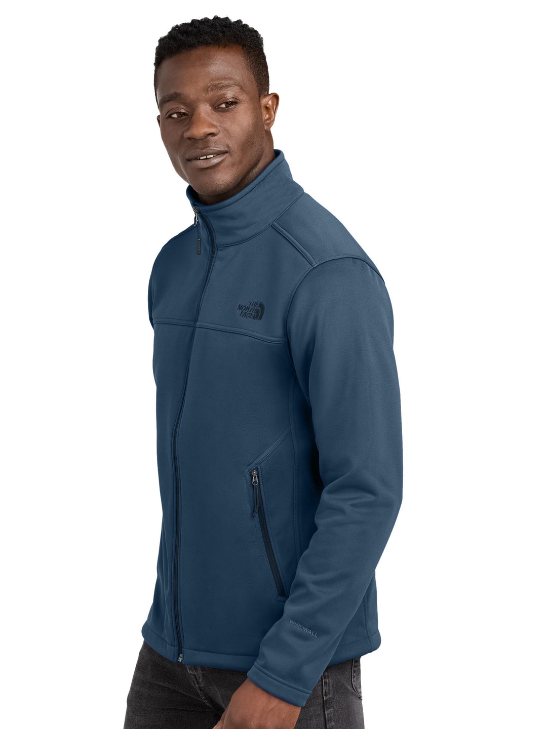 Side view of The North Face® Chest Logo Ridgewall Soft Shell Jacket in navy, featuring zippered pockets and water-repellent fabric.