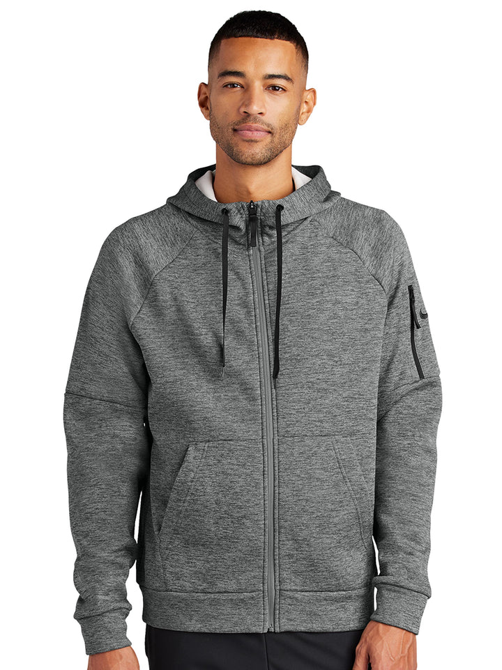 Nike Therma-FIT zip-up hoodie in heather gray with a modern fit. Features a zippered sleeve pocket and is customizable with embroidery or printing.