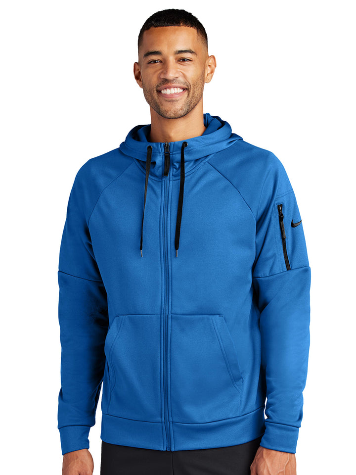 Bright blue Nike Therma-FIT zip-up hoodie with full-zip closure and sleeve pocket. Customizable with logos, perfect for teams and businesses.