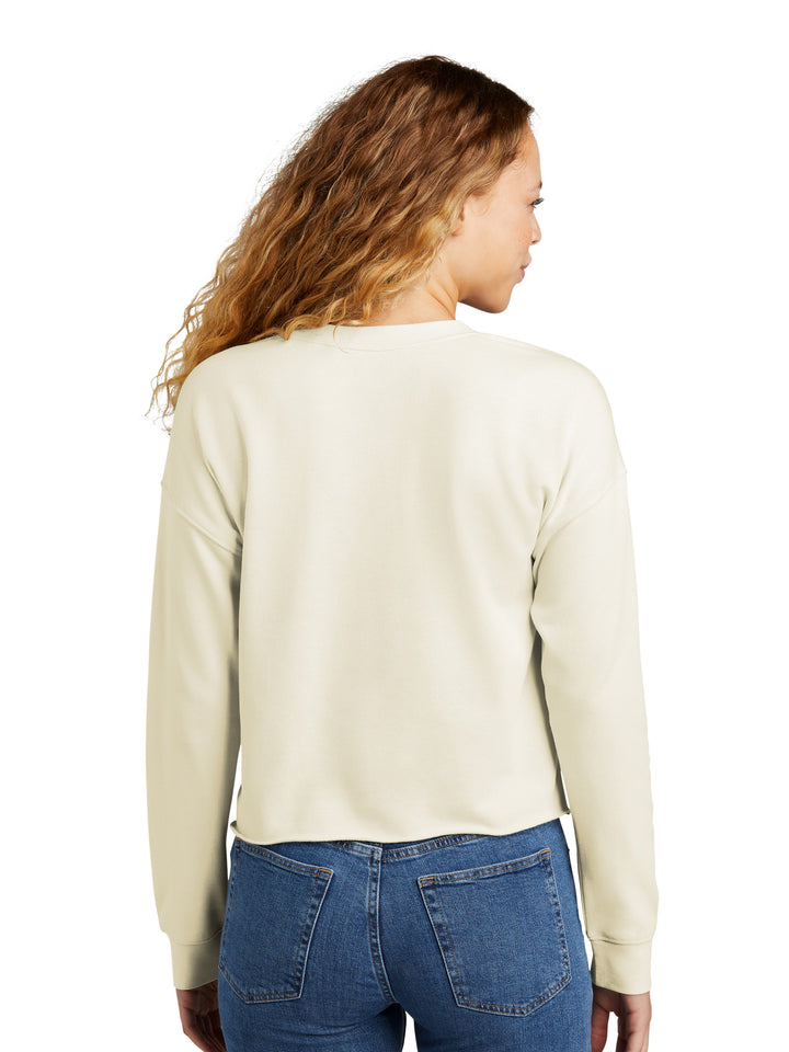 Back view of the New Era Women's Tri-Blend Fleece Crewneck Sweatshirt in beige, highlighting its relaxed silhouette and soft fleece material. Great for everyday wear.