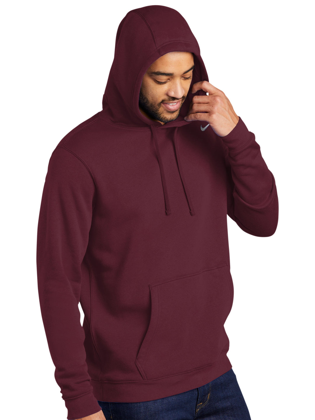 Maroon Nike Club Fleece Hoodie with hood up, offering warmth and style. Customize with embroidery for a unique, personalized touch.