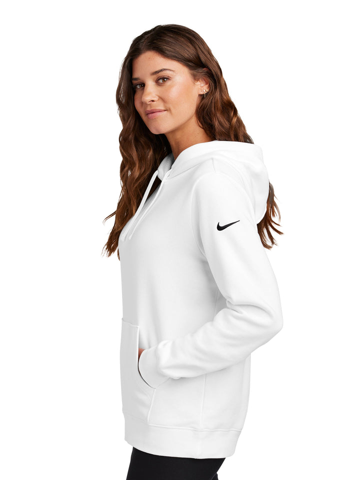 Side view of the Nike Ladies Club Fleece Pullover Hoodie in white, showcasing its relaxed fit, kangaroo pocket, and embroidered Nike logo on the sleeve.