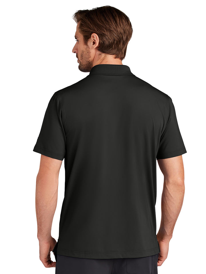 Back view of the Custom OGIO Regain Polo in black, featuring a lightweight and breathable fabric. A great choice for business or casual settings.