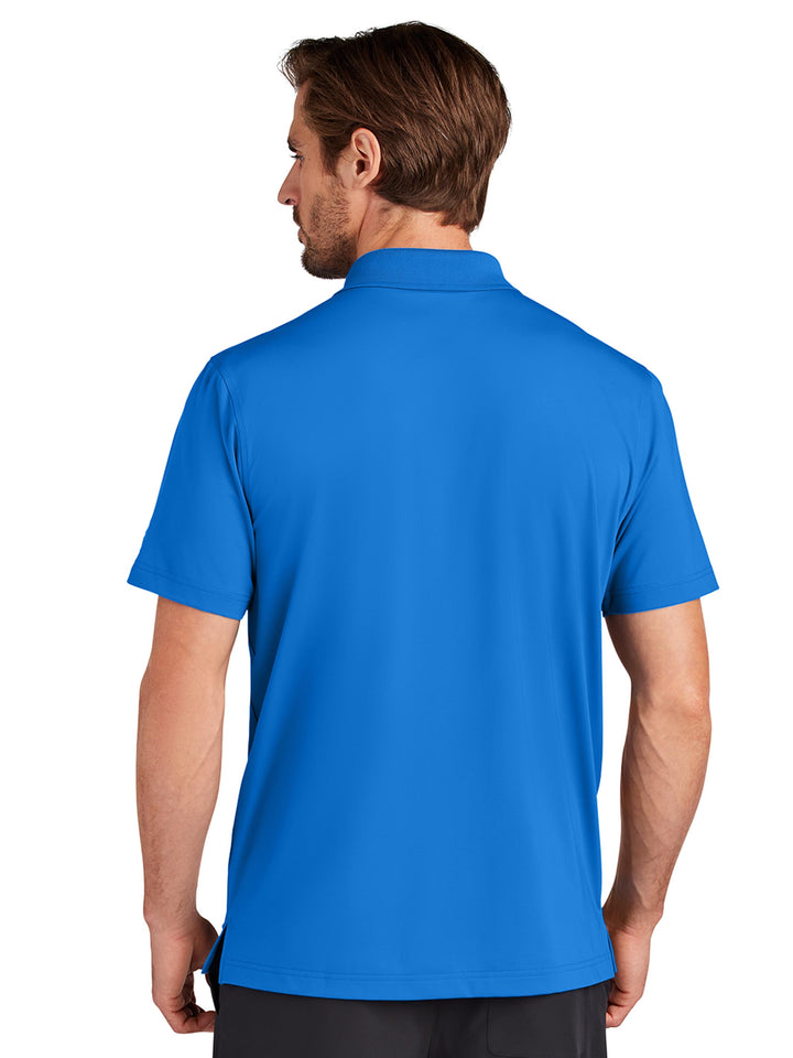 Back view of the Custom OGIO Regain Polo in royal blue, showcasing its breathable and flexible fabric. Ideal for corporate branding or everyday wear.