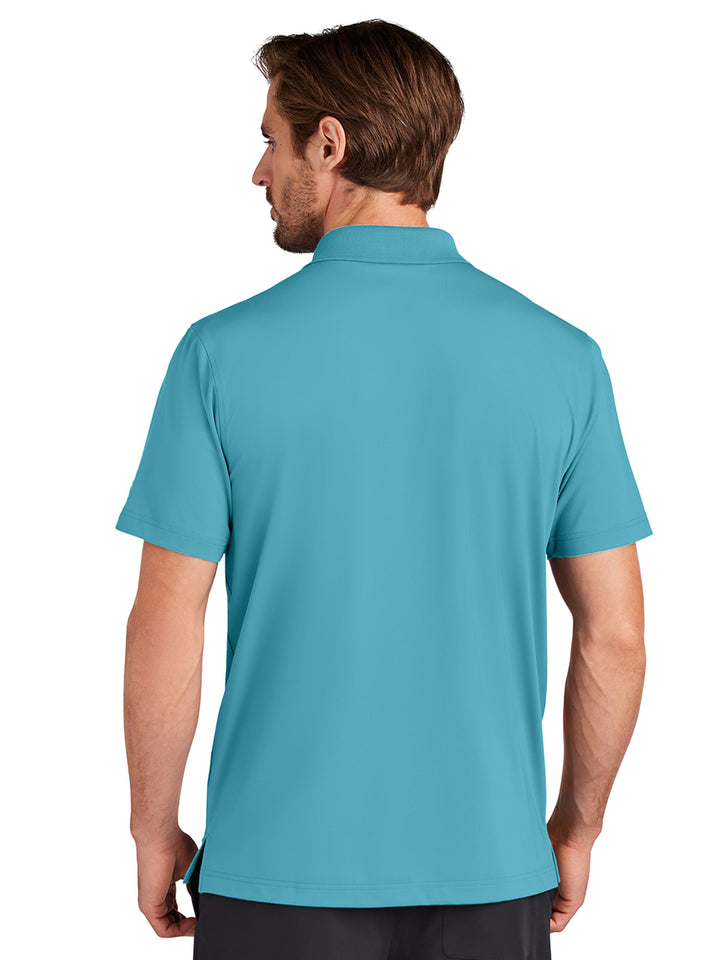 Back view of the Custom OGIO Regain Polo in teal, highlighting its lightweight and breathable fabric. A versatile choice for business or leisure.