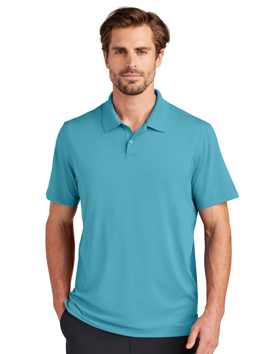 Custom OGIO Regain Polo in teal, featuring a stylish and comfortable design with moisture-wicking properties. Great for work or casual occasions.