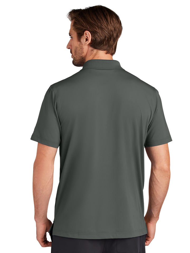 Back view of the Custom OGIO Regain Polo in dark green, showcasing its lightweight and breathable fabric. A versatile choice for business or leisure.