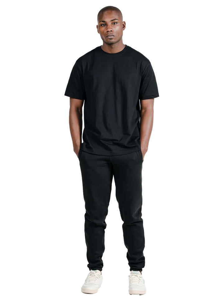 Black Original Favorites Supima Cotton T-Shirt, styled with matching black pants. Premium quality, soft, and breathable fabric.