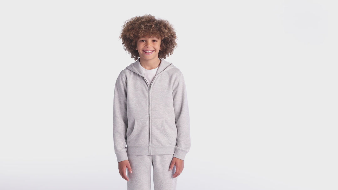 Light gray District Youth V.I.T Fleece Zip Up Hoodie worn by a child, showcasing a comfortable fit, full-zip front, and soft fleece material for everyday wear.